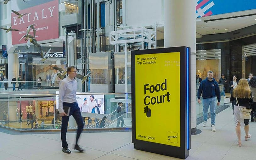 Digital directional sign in a shopping mall guiding visitors to the food court