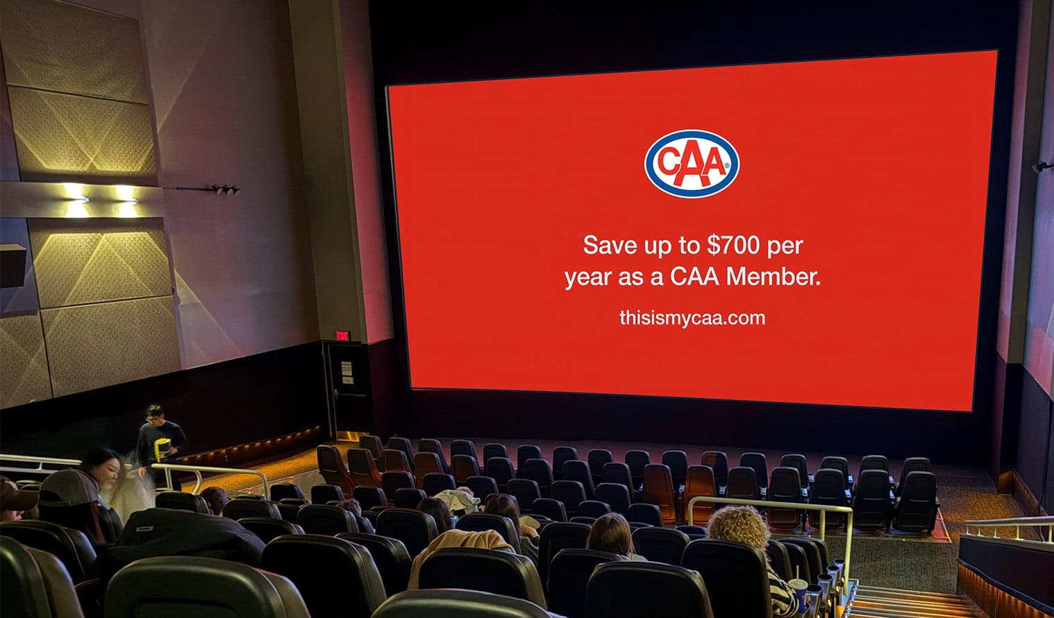 Audience in Cineplex VIP theatre viewing a CAA advertisement on the big screen