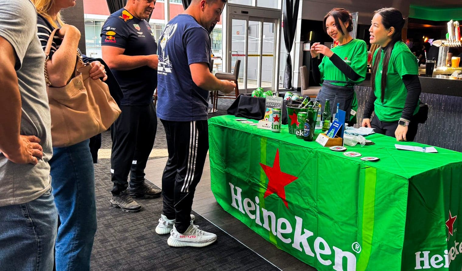 Heineken promotional booth with staff serving samples to guests at Cineplex Cinemas Markham